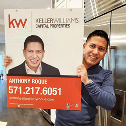 Happy realtor with their custom branded Markful sign